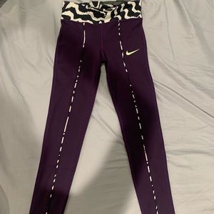 Brand new Big kid (girls)  purple/zebra Nike leggings. Size small